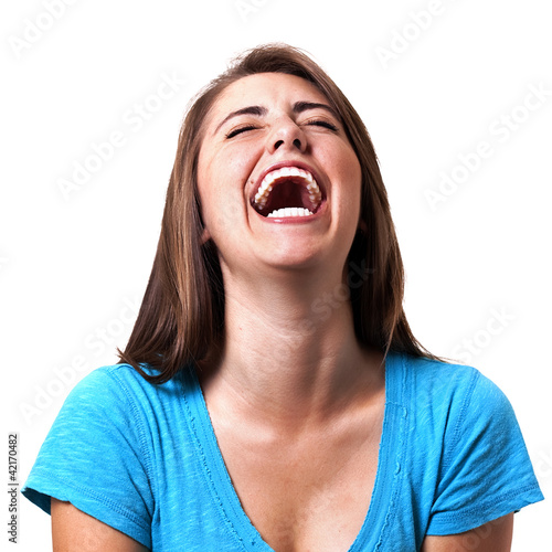 Photo: young woman laughing hysterically young woman laughing hysterically