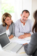 Senior couple ready to buy new house reading contract