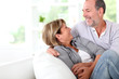 Cheerful senior couple enjoying being at home