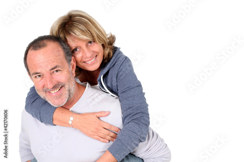 Foto: Senior man holding wife on his back Senior man holding wife on his back
