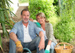 Happy senior couple gardening together