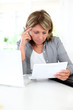Senior woman having problems understanding official documents