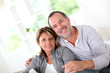 Cheerful senior couple enjoying being at home