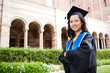 Beautiful young asian woman in graduation cap and gown