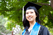 Beautiful young asian woman in graduation cap and gown
