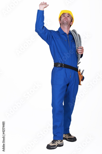 Photo: Electrician touching ceiling Electrician touching ceiling