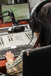 Anchorwoman sitting in front of a microphone