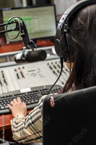 Photo: Anchorwoman sitting in front of a microphone Anchorwoman sitting in front of a microphone