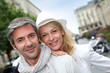 Happy couple doing shopping in town