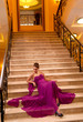 woman in a long dress lying on the stairs