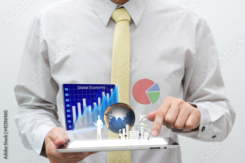 Photo: Business man with touch pad Business man with touch pad