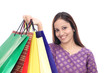 woman holding shopping bags and smiling
