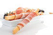 Culinary food background. Prosciutto, bread, black olives.