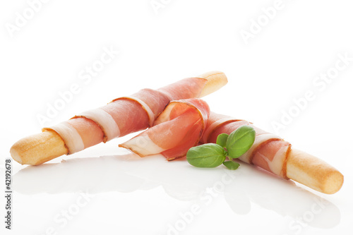 Photo: Grissini bread and prosciutto ham. Grissini bread and prosciutto ham.