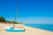 Sailing boats and umbrellas on a beach in Cuba