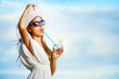 Woman having rest on beach and enjoying a fresh cocktail summer