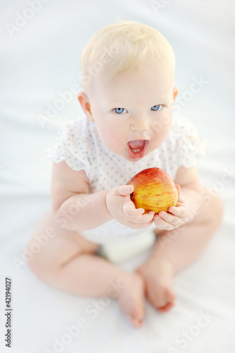 Photo: Baby girl eating healthy food Baby girl eating healthy food