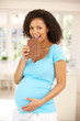 Photo: Pregnant woman eating chocolate Pregnant woman eating chocolate