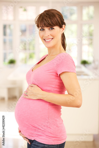 Photo: Pregnant woman at home Pregnant woman at home