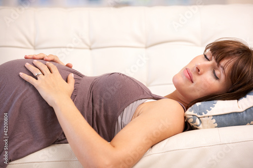 Foto: Pregnant woman resting at home Pregnant woman resting at home