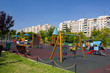 Playground in Bucharest / Children park against communist flats