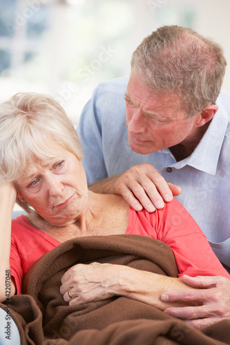 Photo: Senior man looking after sick wife Senior man looking after sick wife