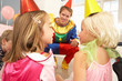 Clown entertaining children at party