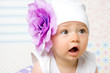little girl in hat with flower 