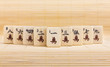 Old chinese game mahjongg on bamboo mat background