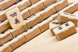 Old chinese game mahjongg on bamboo mat background