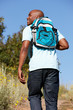 Foto: Young man on country hike Young man on country hike
