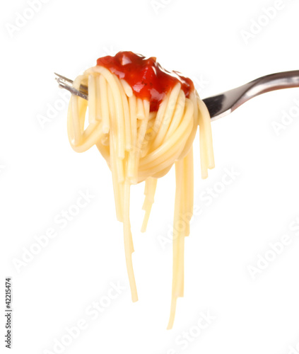 Photo: Delicious spaghetti on a fork close-up on white background Delicious spaghetti on a fork close-up on white background
