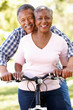 Senior  couple cycling in park