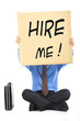 Businessman holding the  text Hire Me