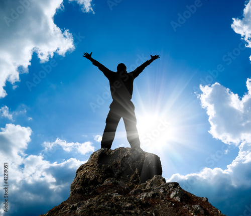 Photo: Man on top of mountain. Man on top of mountain.