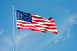 USA Flag on pole waving in the wind