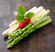 Decorative bunches of green and white asparagus
