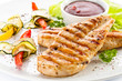 Grilled chicken breasts and vegetables