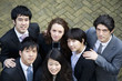Multi ethnic business group looking up