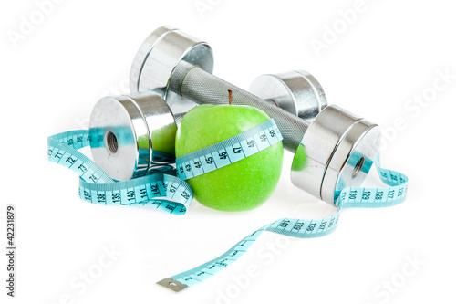 Photo: Dumbbells and apple. A healthy way of life Dumbbells and apple. A healthy way of life