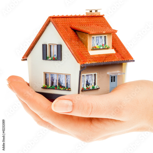 Photo: house in human hands house in human hands