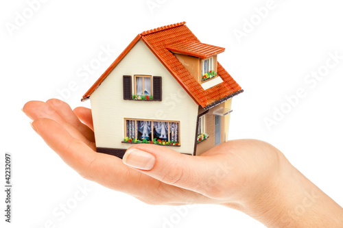 Photo: house in human hands house in human hands