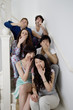 Group portrait of young friends yawning