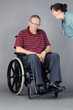 Photo: Sad senior man in wheelchair being shouted at by nurse Sad senior man in wheelchair being shouted at by nurse