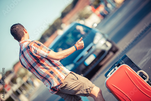 Photo: Young Man Hitchhiking Young Man Hitchhiking