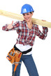 Female carpenter with wood