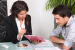 Female banker sat with investor
