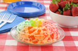 Gelatin parfait with a bowl of strawberries