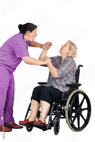 Photo: Nurse assaulting senior woman in wheelchair Nurse assaulting senior woman in wheelchair