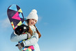 Happy sportswoman with snowboard